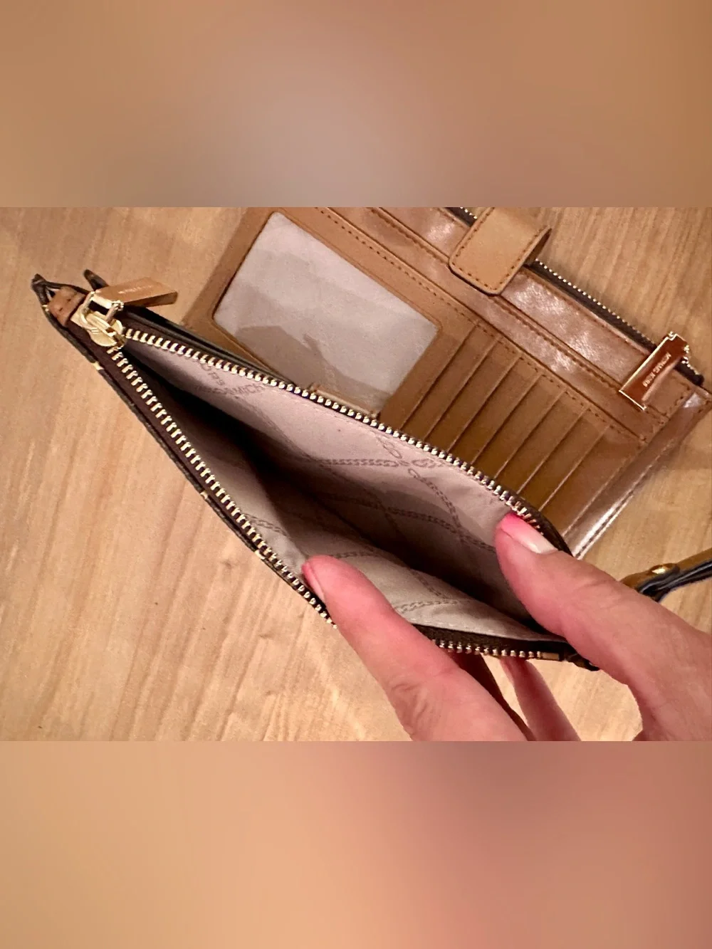 Michael Kors Black Star Print Wristlet with Tan Strap